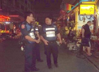 Tourist police volunteers patrol Jomtien Beach bars to give holiday revelers a greater sense of security.