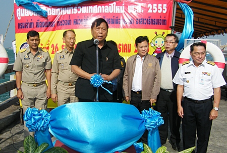 Deputy Transportation Minister Kittisak Hatthasongkhrao talks to people gathered at Bali Hai pier about the importance of water safety. 