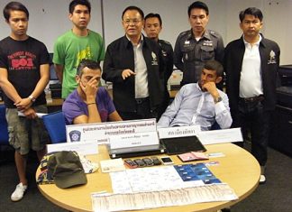 Hassainia and Raihane face the press after being caught using counterfeit credit cards to steal from Thai ATMs.
