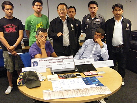 Hassainia and Raihane face the press after being caught using counterfeit credit cards to steal from Thai ATMs.