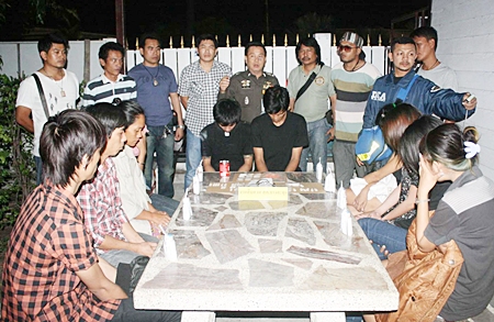 Police bring out the accused for the media. 