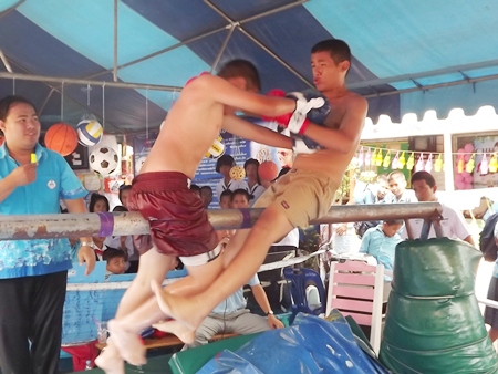 Greased pole Thai boxing is part of the fun at the event.