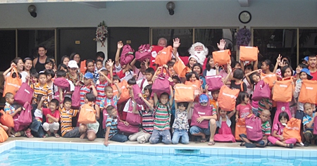 Ban Jing Jai children cheer for Santa on New Year’s Day. 