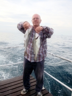Peter Hyland with his two blue-spotted cod 