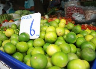 An after effect of last year’s major flooding has been increased inflation, including limes such as these at the Naklua market.