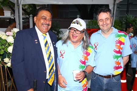 Past President Wanit Mekdhanasarn, brainchild of the Coins on Silom many years ago, is flanked by Past District Governor Peter Malhotra (left) and Mark Butters, president of the Rotary Club of Bangkok South.
