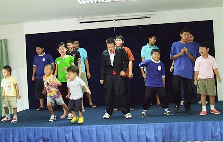 The children give a rousing dance performance during the ceremony.