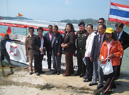 Senate Sport Committee members, led by Sen. Niramol Siriwat, prepare to board a solar powered boat with potential for use in flood crises. 