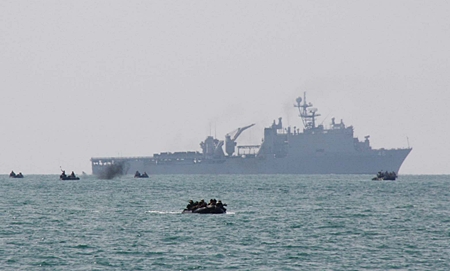 Armed forces leave their transport ship and head for Had Yao Beach.