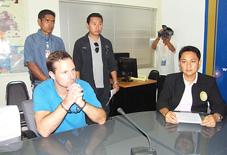 Matthew Dray Plueger (seated, left) is being deported back to the U.S.A. to face drugs charges.