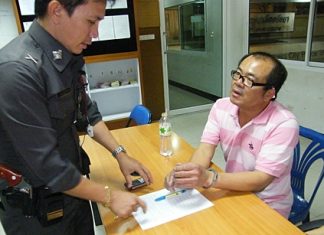 Thanadet Phatthanawaradet (seated) is brought in for shoplifting and possession of illicit drugs.