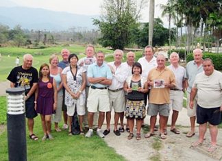 Royal Hills road trip golfers pose with wives and girlfriends for a group photo.