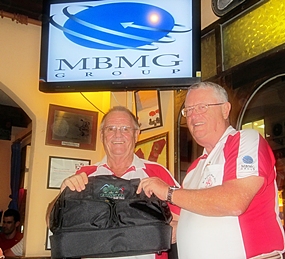 The Scribe (left) receives the MBMG Golfer of The Month award from Dick Warberg.