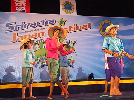 Thai dancers perform a “Ram Kow”, a dance to help the rice harvest.