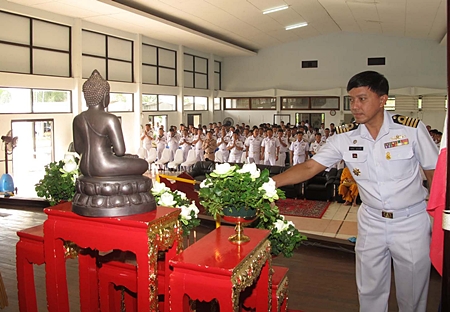 Adm. Somchai Na Bangchang, deputy commander of ACDC, leads more than 300 soldiers to perform Buddhist religious rites.