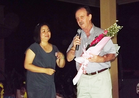 Stephen Beard presents a bouquet to Pianta, thanking her for her unbounded sacrifices for the children.