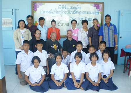 The group, which includes the principal, faculty, Pattaya YWCA, Police Academy members, students and us.