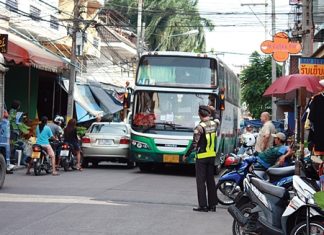 Some bus drivers still haven’t learned the size of their buses, and often attempt to drive them places where they don’t belong. Here, municipal officer Kietinarong Panpra helps guide a large bus down a narrow soi. For more on what municipal officers’ duties are in helping the city.