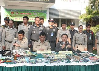 Officers display the cache of drugs, weapons and other paraphernalia confiscated during a search of Pattaya Remand Prison in Nong Plalai.