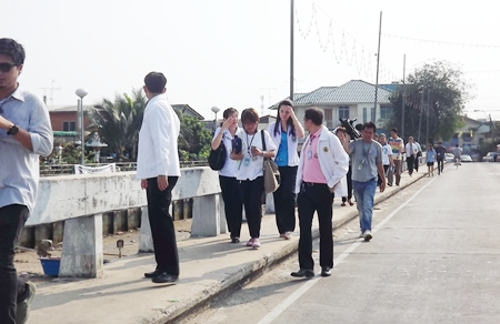 Local politicians and medical people take to the streets in Naklua to visit elderly folks too sick to make it to see their doctor. 