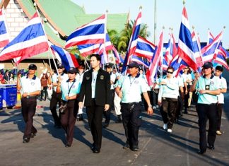 Mayor Itthiphol Kunplome leads the “Pattaya Team” parade, announcing a joint effort to provide better goods, services and security for area residents and visitors.