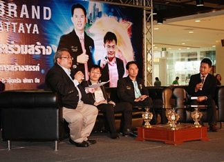 (L to R) Asst. Prof. Thatchai Chuenchom addresses a large group of Pattaya entrepreneurs (not shown) as Thanyawat Chaitrakulchai, Mayor Itthiphol Kunplome and moderator Kamphoo Phurpuwadol listen in.