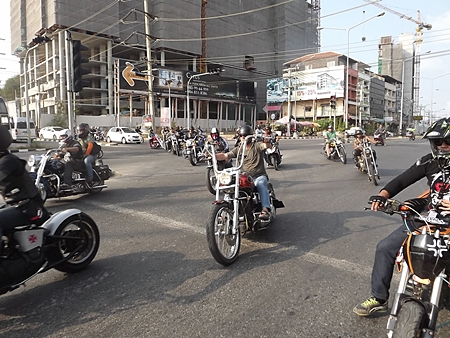 Motorcycles parade down Pratamnak Hill.