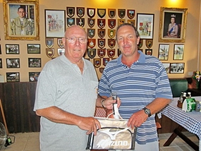 Max (left) presents the MBMG Golfer of the Month award to Rob Brown.