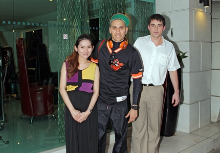 Taboo (centre), a member of the Black Eyed Peas entertainment group is welcomed by Natsathida Thanatulsutanant (left), manager of the Amari Nova Suites Pattaya and Sascha Kunze (right), manager of Nova Platinum during his stay at the resort recently.