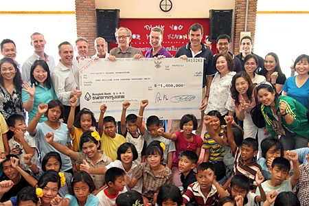 Karl Morsbach (6th left), Chairman and Founder of Baan Gerda Project recently received a donation cheque for 1.4 million baht from Pierre Andre Pelletier (3rd left), GM of the Amari Watergate Bangkok and Matthias Pfalz (8th left), President of BMW (Thailand) Co., Ltd. The Funds were part of the 3.3 million baht raised from “The 14th Amari Watergate & BMW Group Thailand Midnight Run” and “The 15th Aerobic Marathon on AIDS” to support the HIV orphanage in Lopburi Province. The 1.4 million baht will be donated through HRH Princess Maha Chakri Sirindhorn to support the Chalerm Prakiat School in Lumpoon province and the other 500,000 baht already donated to support Baht for a Better Life Project.