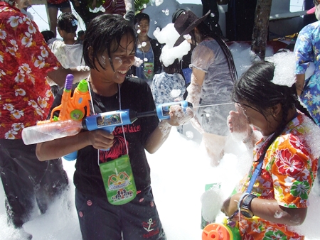 Children enjoy the foam party.