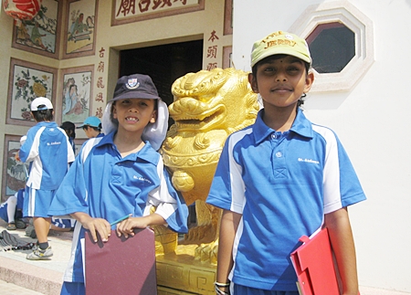 The Singha lions outside the temple.
