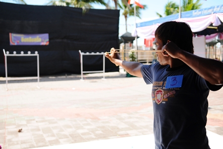 Steady, steady, fire … aiming for the bullseye in the slingshot competition.