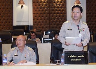 Mayor Itthiphol Kunplome (standing) addresses the Pattaya City Council.
