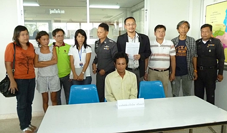 Sithichai Sroimalee (seated) has been charged with molesting a minor and drug use. 