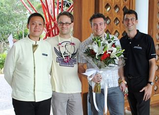 (Left to right) Nakaret Butthuam, Head Butler, Colin Baugart, Mathias Urbaczek (the resort’s first guest) and Arnaud Girodon, General Manager.