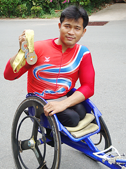 Supachai Koysub shows a selection of his winning medals from previous Olympic Games. 