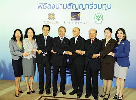 Executives of Siam Piwat and Magnolia Quality Development, together with the CP Group pose at a press conference to announce the new 35 billion baht development.