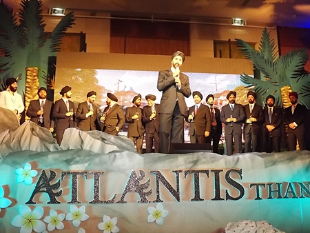 Chawarin Sakulsacha, front centre, leads the developers of Atlantis Condominium in thanking all their customers and guests at the party.