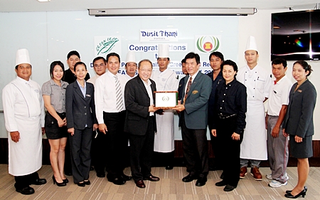 Chatchawal Supachayanont (centre left), GM of the Dusit Thani Pattaya and members of the hotel’s Green Team proudly receive the ASEAN Green Hotel Standard 2012-2014 from Dr Jiraphol Sinthunava, vice-president of the Green Leaf Foundation. Dusit Thani Pattaya has maintained its eco-friendly status since it embraced the green initiatives more than ten years ago. This has resulted in their receiving many awards from various environmental organizations recognizing the work of the resort’s Green Team committee under the management and supervision of Chatchawal Supachayanont.
