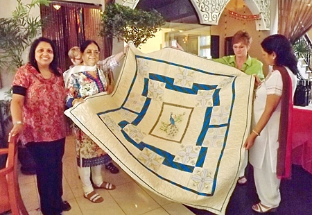 Binota Banerjee is thrilled as she receives a gift of love and appreciation from the Rotary International directors’ spouses.