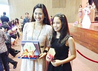 Praw poses with her teacher Kru Pearl, who also won an award.