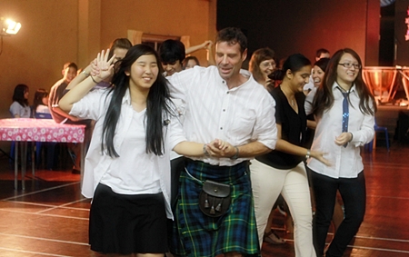 Mr. Andrew Gordon leads the Scottish dance. 