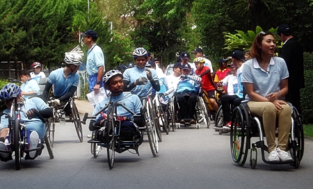 Wheelchair marathon riders are anxious to get underway at the release of the caravan towards Nong Khai. 