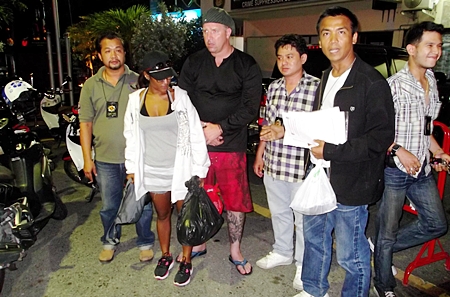 Alleged Swedish armed robber Bo Peter Soderback and his girlfriend Wannapa Singprakon are apprehended at their Third Road apartment.