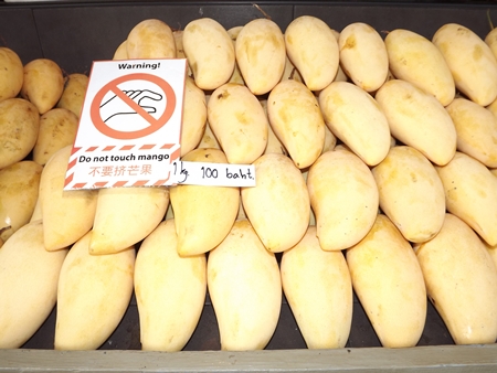 Don’t squeeze the mango.  Prices are up, but people still can’t live without their sweet mango on sticky rice covered in coconut milk dessert. 