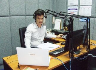 Station manager Panthakan Phromprangkun works the morning show.