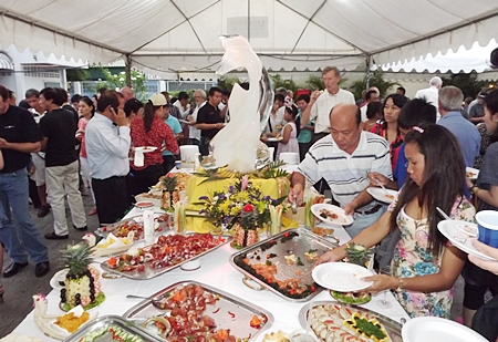Guests dig in to the delicious food and wine laid out for the occasion. 