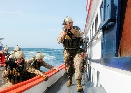 U.S. Marines, assigned to Fleet Anti-terrorism Security Team Pacific (FASTPAC), board a Thai fishing vessel from a U.S. Coast Guard short range prosecutor during a visit, board, search and seizure (VBSS) exercise with the Royal Thai Navy (RTN). The RTN sailors and officers pretended to be fisherman who had their vessel boarded by the Marine FASTPAC team. The VBSS exercise also included a maritime law enforcement team, assigned to USCGC Waesche (WMSL 751). (U.S. Navy photo by Mass Communication Specialist 1st Class N. Ross Taylor/Released)