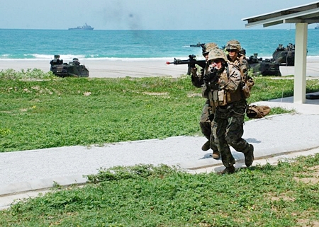 U.S. Marines with Company F, 2nd Battalion, 3rd Marine Regiment, conduct a clearing exercise in a Military Operations on Urban Terrain (MOUT) training area as part of a simulated amphibious assault conducted with Royal Thai Marines. (U.S. Navy photo by Chief Mass Communication Specialist Daniel J. Calderón/Released)